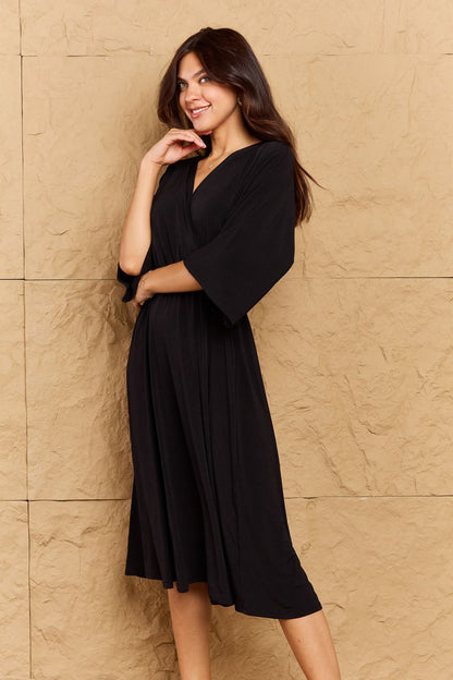 ON THE LAND Black Make Your Move Solid Surplice Midi Dress