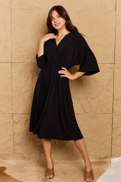 ON THE LAND Black Make Your Move Solid Surplice Midi Dress