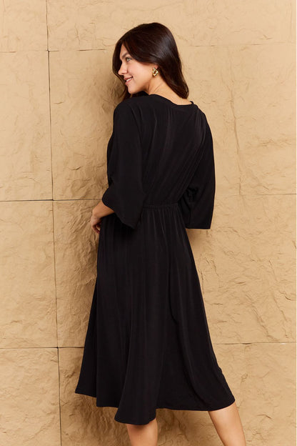 ON THE LAND Black Make Your Move Solid Surplice Midi Dress